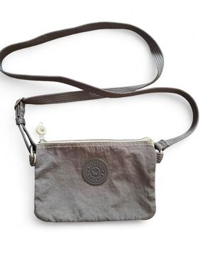 KIPLING gray small crossbody bag. 3 separate compartments, great for travel